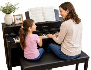 Teacher & student playing piano duo